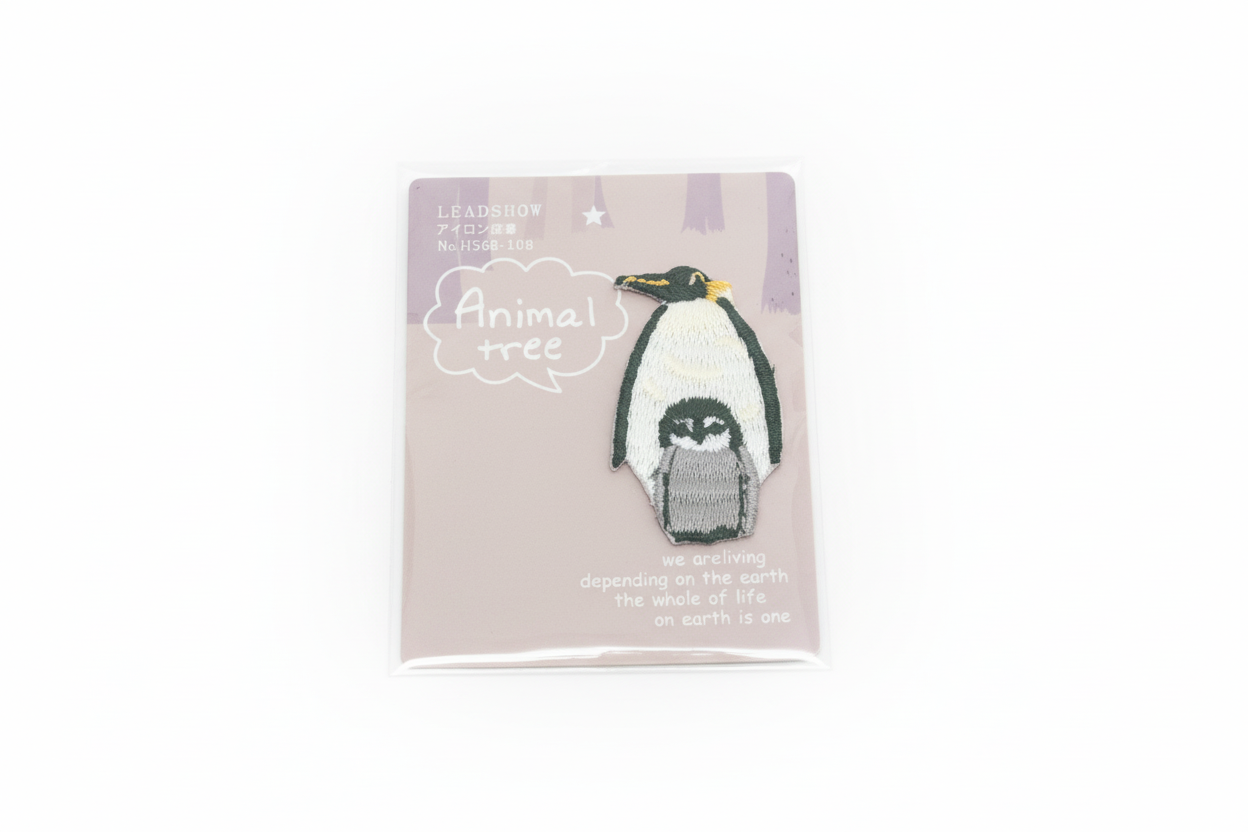 Iron-on penguin patch with baby
