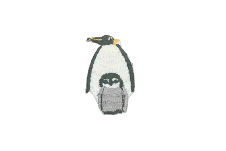 Iron-on penguin patch with baby