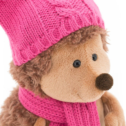 Fluffy hedgehog plush toy with double pom-pom hat, 15 cm