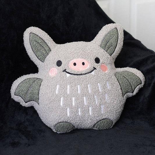 Coussin chauve-souris mignon en bouclé